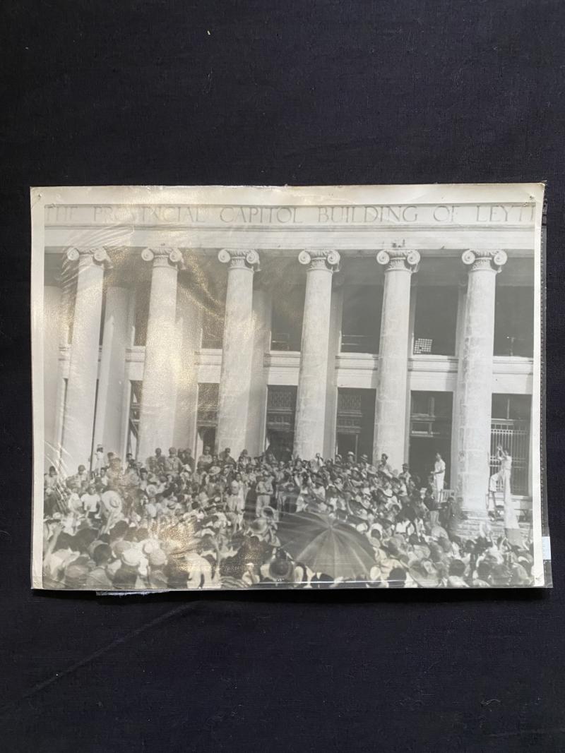 U.S. SIGNAL CORPS PHOTO OF A CROWD OF CHEERING FILLIPINOS AND AMERICANS, BRIGADIER CARLOS ROMULO