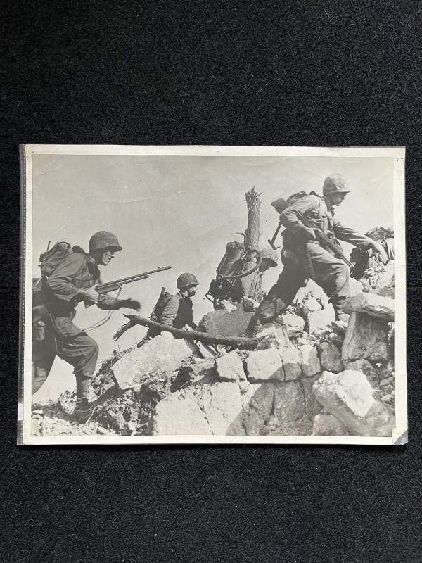 U.S. MARINES HURDLE STONE WALL IN OKINAWA ADVANCE